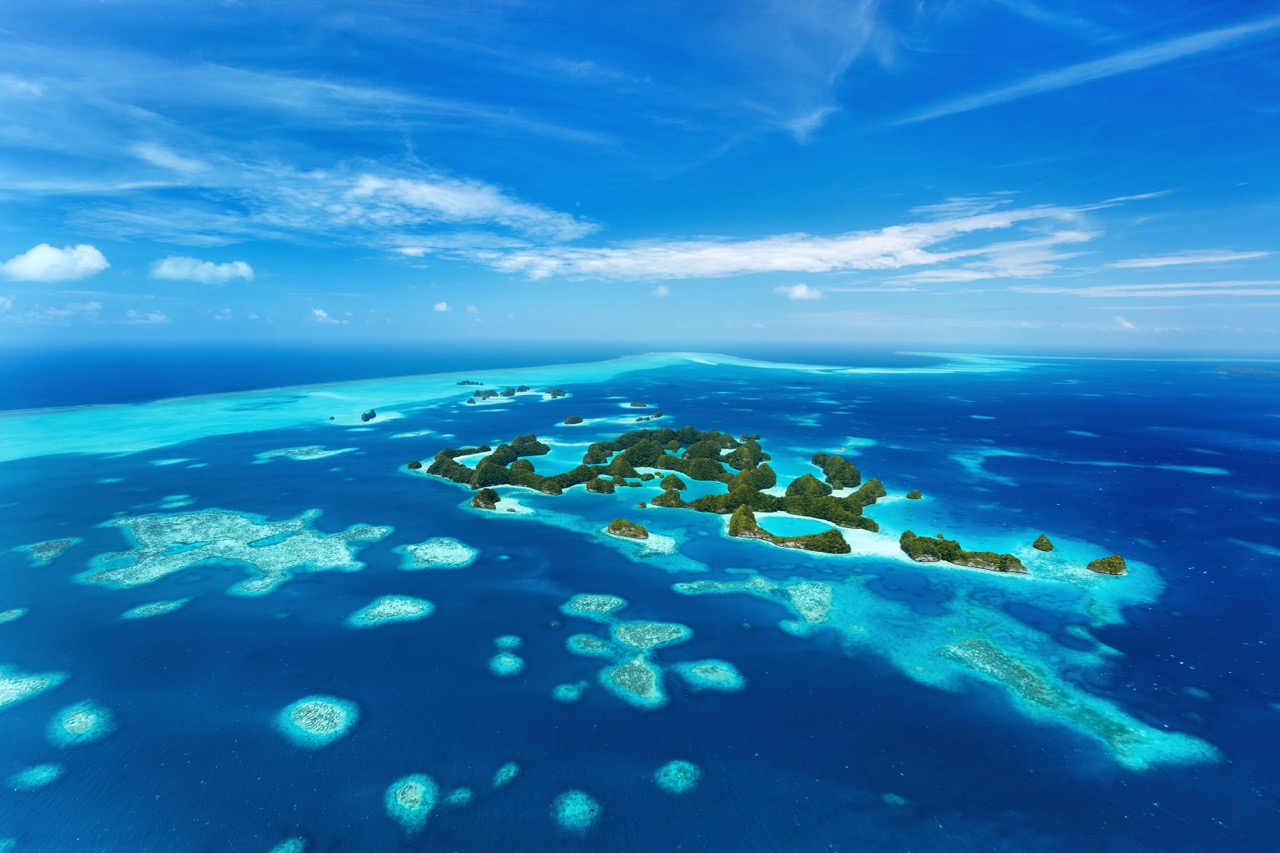 The islands of Palau An aerial view of the islands of Palau, home to Blue Corner which is often named one of the 10 best dive sites in the world