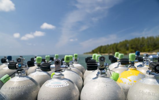 a collection of scuba tanks