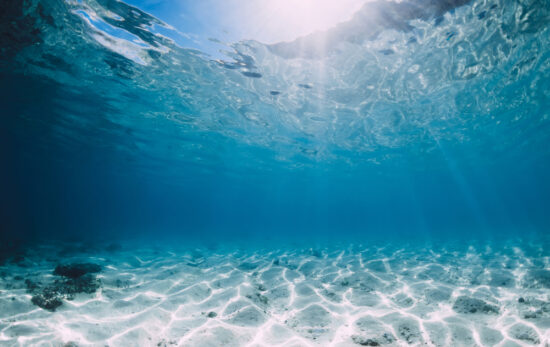 shallow water with light rays coming through